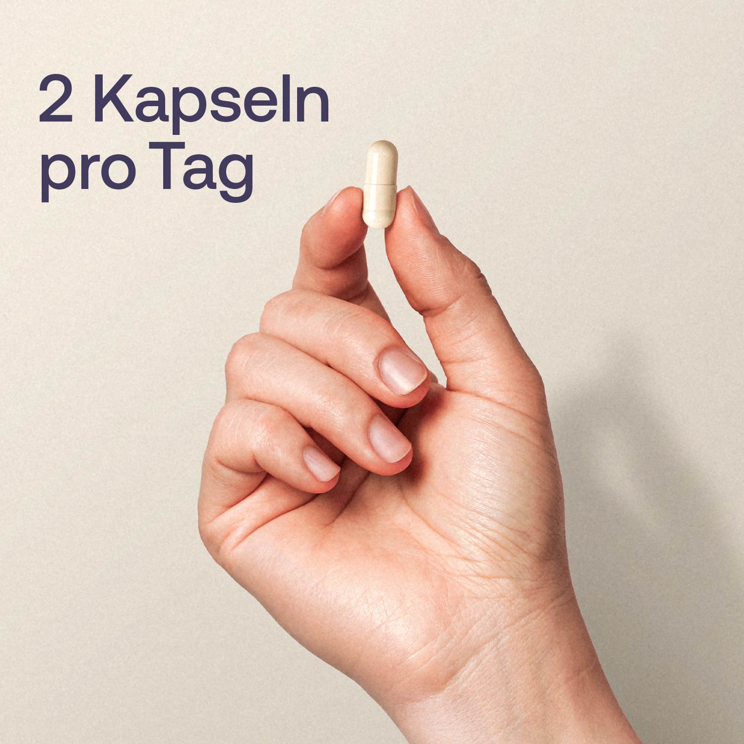 Eine Hand hält eine Kapsel
